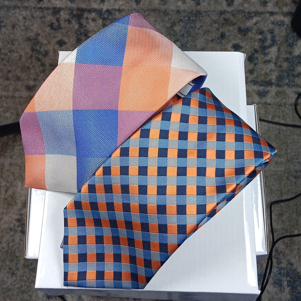 Pair of orange and blue polyester Izod ties.